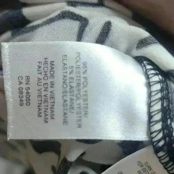 Ann Klein black and white design dress with orange strip stripe on bottom. - Picture 6 of 6